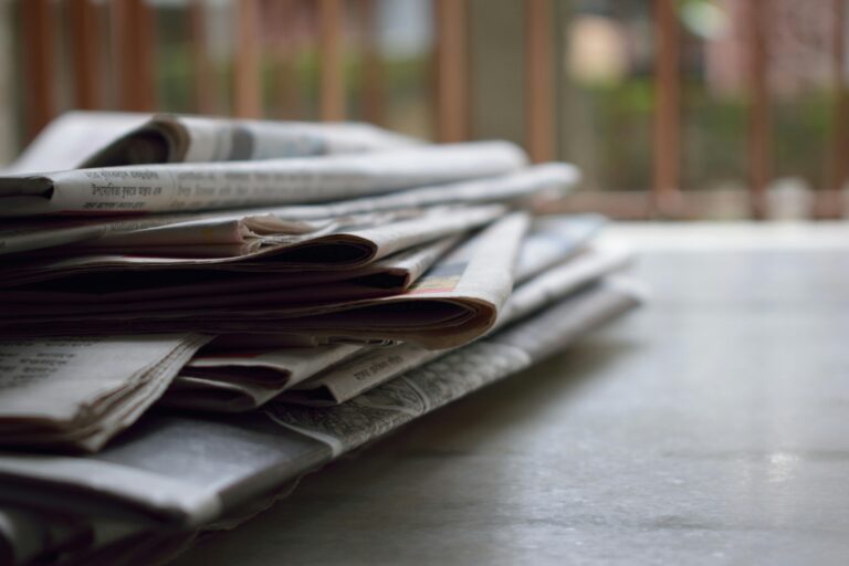 Newspapers on a table.