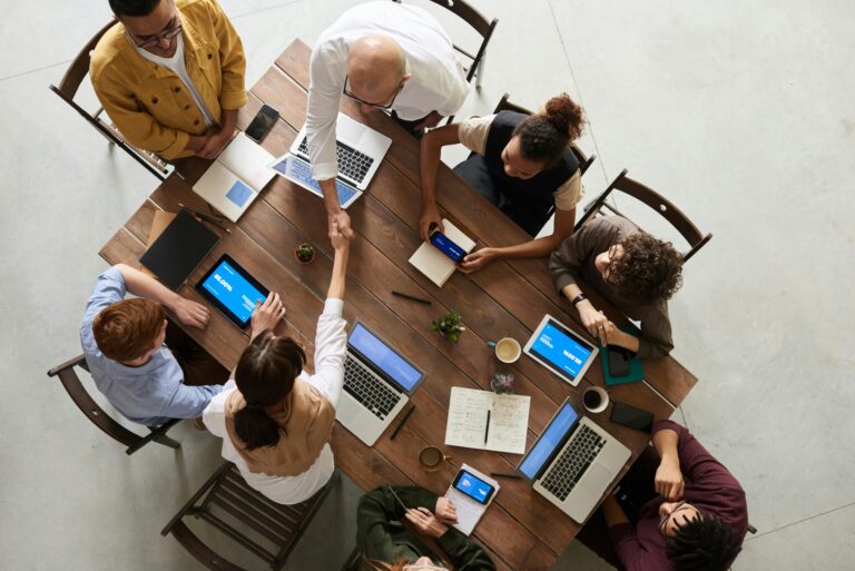 Group of people working at a table. Living Lab Framework established